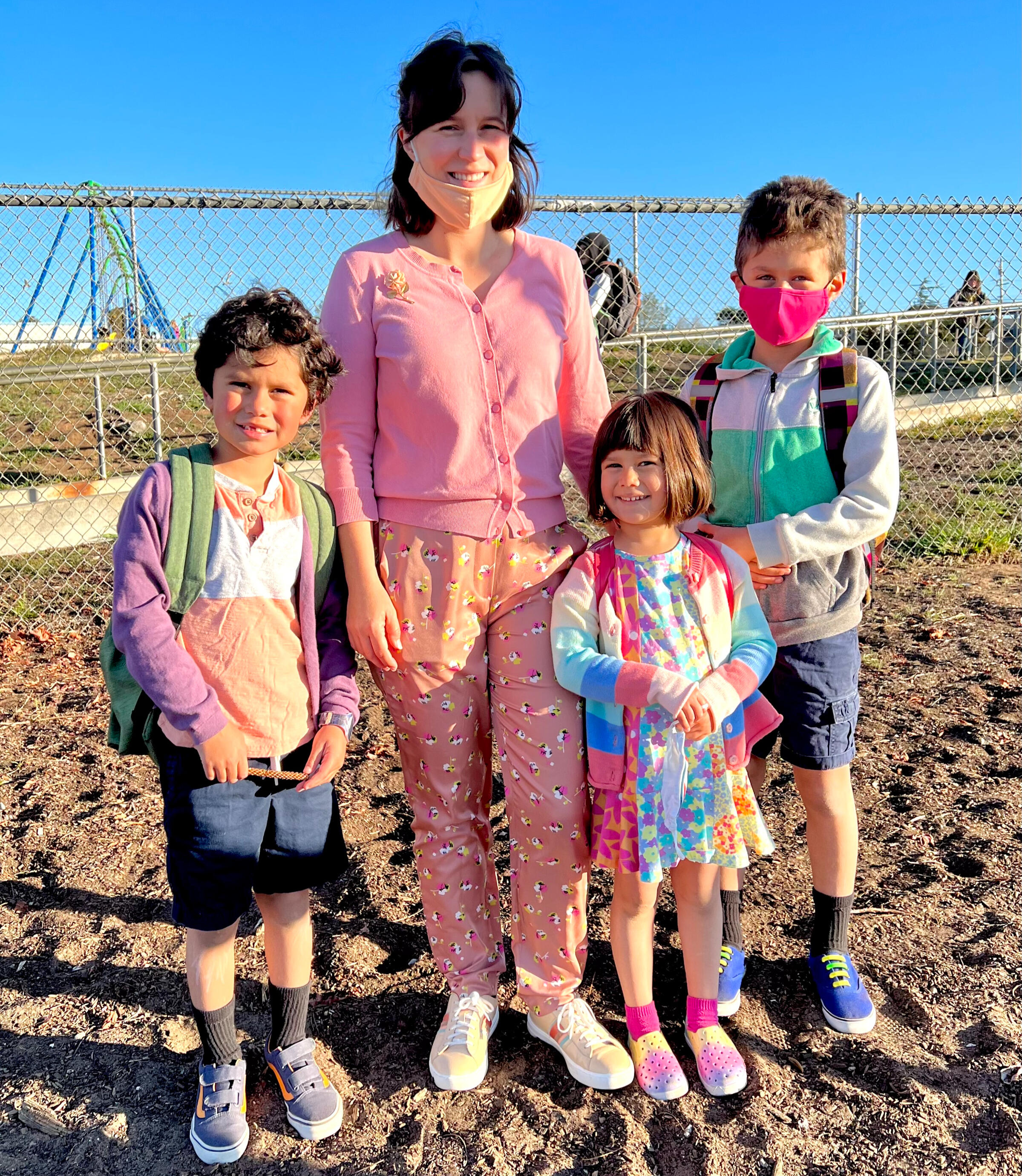 Marisa Gomez dropping off her three kids at school, wearing and carrying face masks
